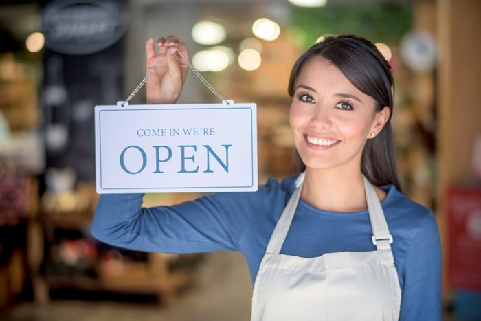 woman-open-for-business-sign